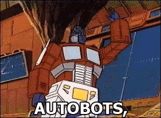 Optimus Prime from the Transformers cartoon transforming into a truck, captioned "Autobots, roll out!"