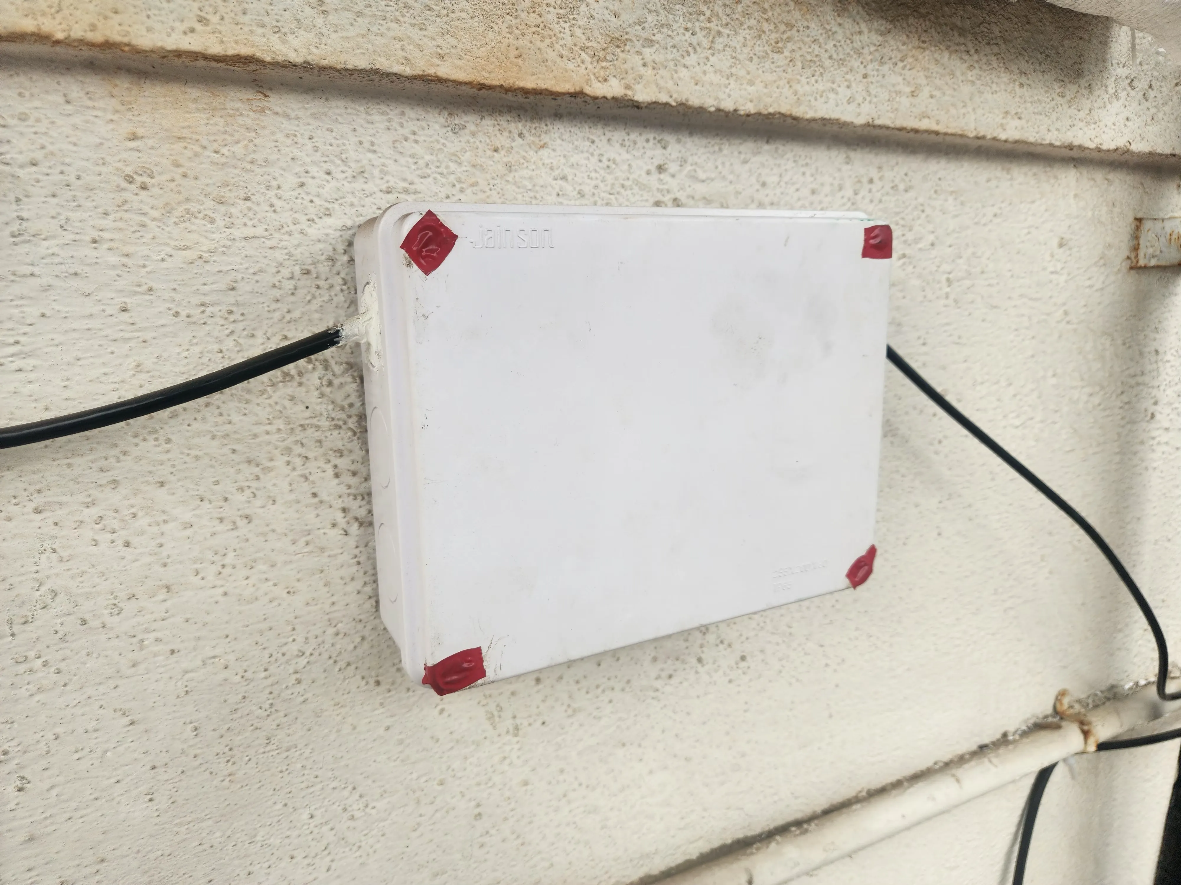 The sealed electrical box closed up and installed under the tank platform.